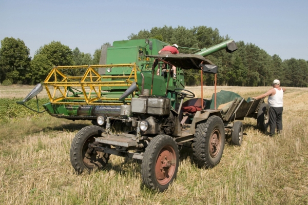farming tractor and a farmer in the field