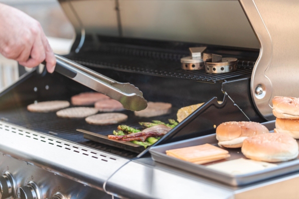 Cooking hamburgers on outdoor gas grill