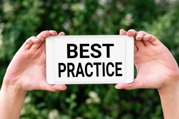 Best Practice displayed on a smart tablet held up by a woman's hand