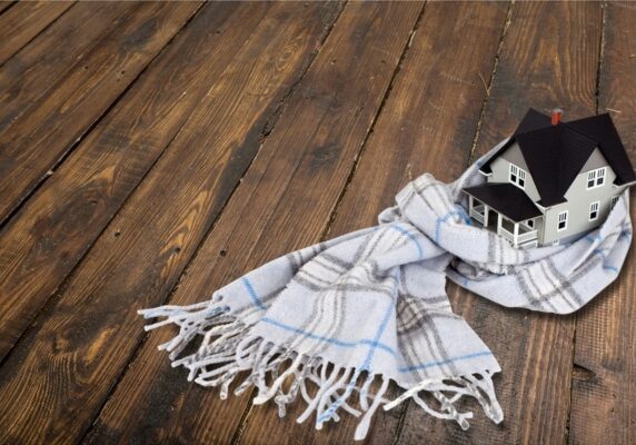 scarf around a miniature house Smarter Oil Heat_ Maximizing Efficiency In 2026